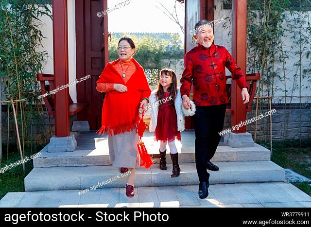 The grandparents and granddaughter to celebrate the New Year of happiness