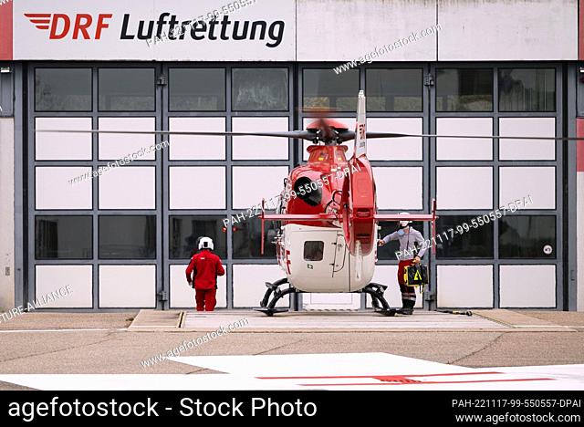 PRODUCTION - 15 November 2022, Baden-Wuerttemberg, Leonberg: A rescue helicopter stands on the helipad of the Leonberg station of the DRF Luftrettung