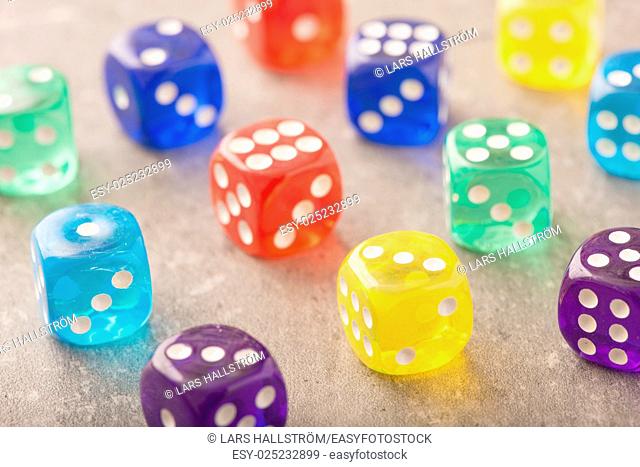 Colorful dice in close up. Concept image of leisure game, risk and chance. Symbol of success or luck