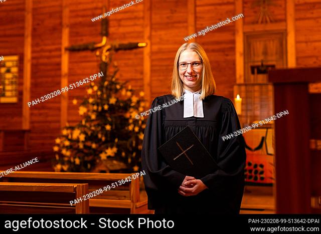 PRODUCTION - 01 February 2023, Baden-Württemberg, St. Blasien: Pastor Lisa Rudzki stands in the Lutheran Christuskirche. The clergywoman also plays a pastor...