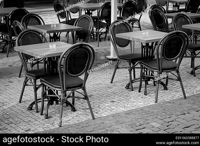 An empty table with two chairs in a restaurant
