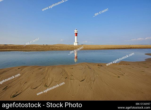 Lighthouse Far del Fangar at sandy beach, ebro river delta, Catalonia Spain