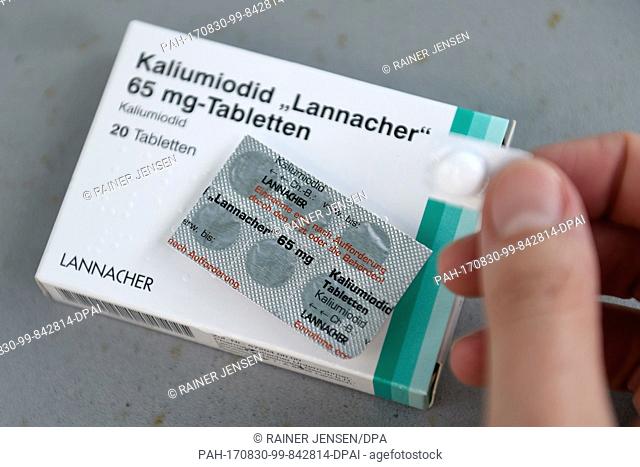 A blister of iodine tablets can be seen in the hands of a member of the Vitr family in Aachen, Germany, 28 August 2017. From the 1st of September onwards free...