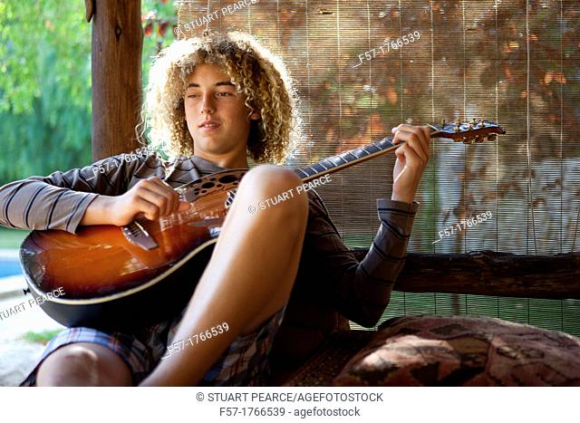 Teenage musician with his guitar