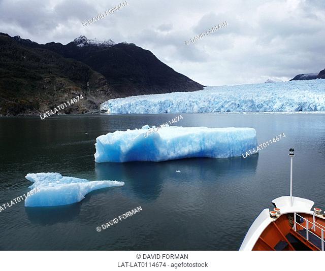 Lake. Icebergs. cold. boat. bow. tour. cruise. cloud. glacier. environment