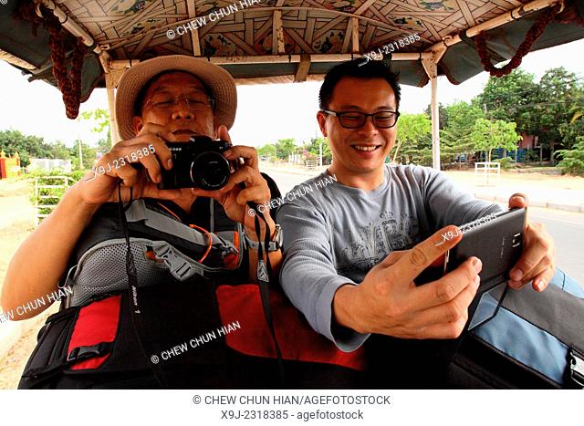 Man Take a Selfie while Visiting to seam reap, cambodia