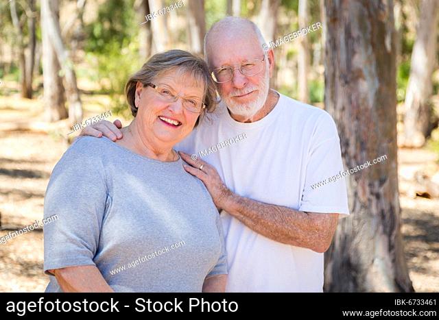 Happy senior couple portrait outdoors at park