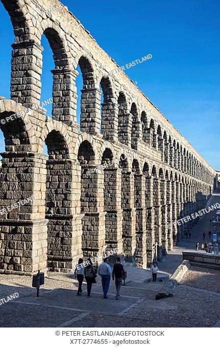Looking along Segovia's 1st century Roman Aqueduct in the Plaza Azuguejo, Segovia, Spain