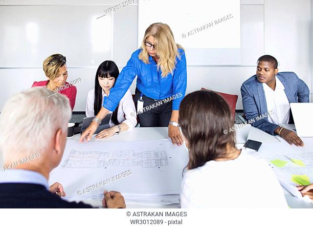 Team of architects and project managers working in office