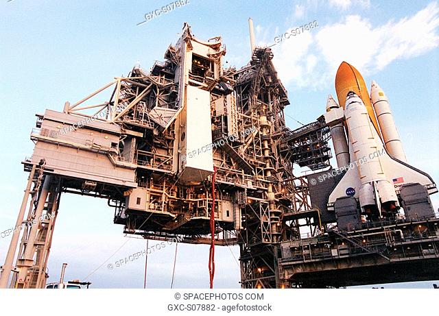 02/23/2001 --- At Launch Pad 39B the payload canister, with the Multi-Purpose Logistics Module Leonardo inside, is lifted to the payload changeout room on the...