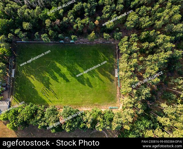 PRODUCTION - 26 July 2023, Saxony, Großdittmansdorf: View from above on the soccer field of SV Grün-Weiß Großdittmannsdorf. (Taken with a drone)