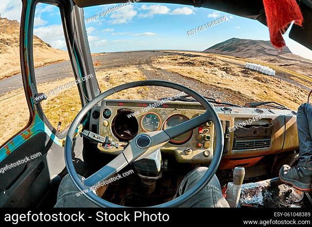 Junk abandoned truck interior, disintegrated dashboard