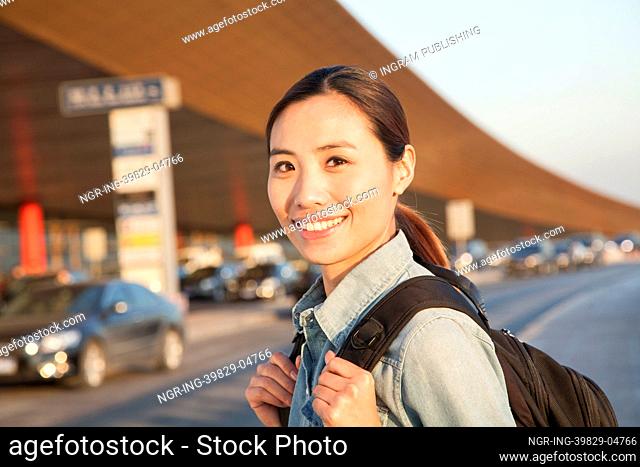 Young traveler portrait outside of airport