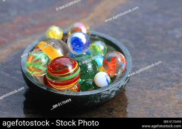 Marbles in bowl, toys, glass marbles, glass marble