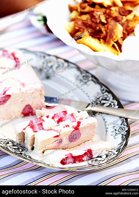 Strawberry parfait with caramelized puff pastry and meringue crumbs