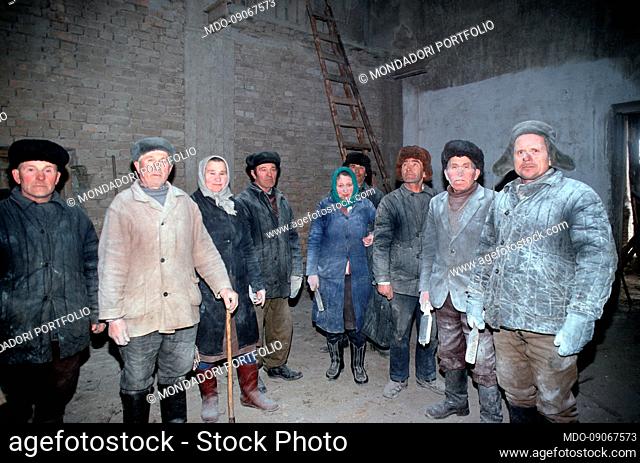 Volunteers during the renovation of the church transformed by the Communists into a mill. In 1945 the communist regime transformed this church into a warehouse...