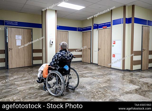 RUSSIA, ST PETERSBURG - DECEMBER 11, 2023: A wheelchair-bound COVID-19 ward patient receives medical treatment at St George City Hospital