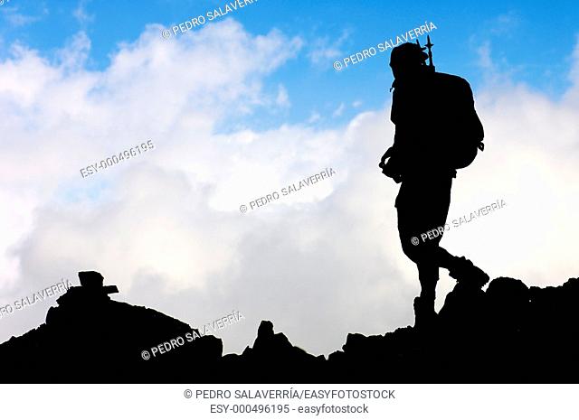 Lonely hiker with blue sky