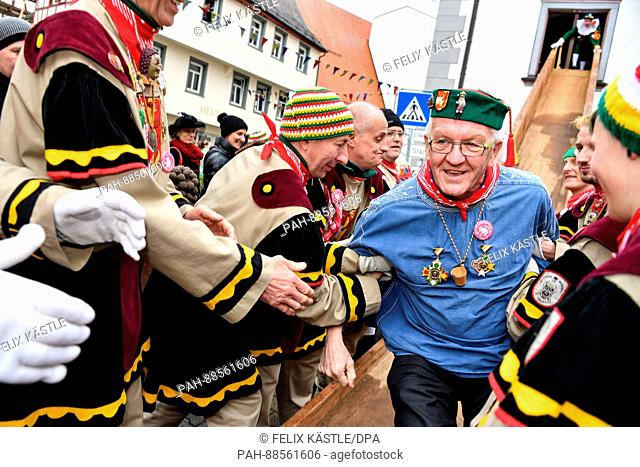 Prime Minister of Baden-Wuerttemberg Winfried Kretschmann (The Greens) can be seen dressed up in a jester costume leaving a traditional culinary event in the...