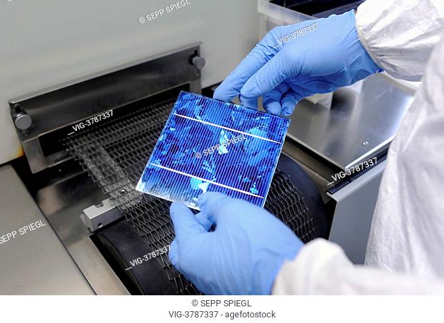 Germany, Gelsenkirchen, The Laboratory and Service Center (LSC) of the Fraunhofer Institute for Solar Energy Systems. With a silver paste the wafer front and...