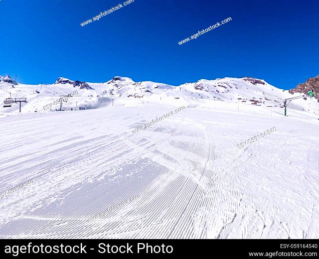 winter skiing area on a glacier with a ski slope