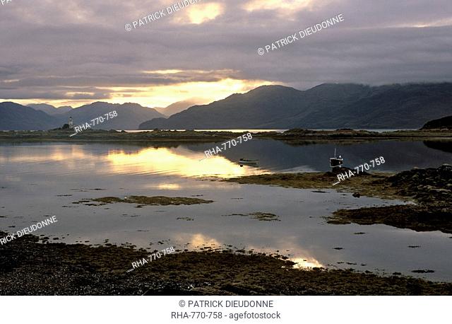 Sunrise over Isleornsay and lighthouse, Knoydart mountains behind, Isle of Skye, Inner Hebrides, Scotland, United Kingdom, Europe