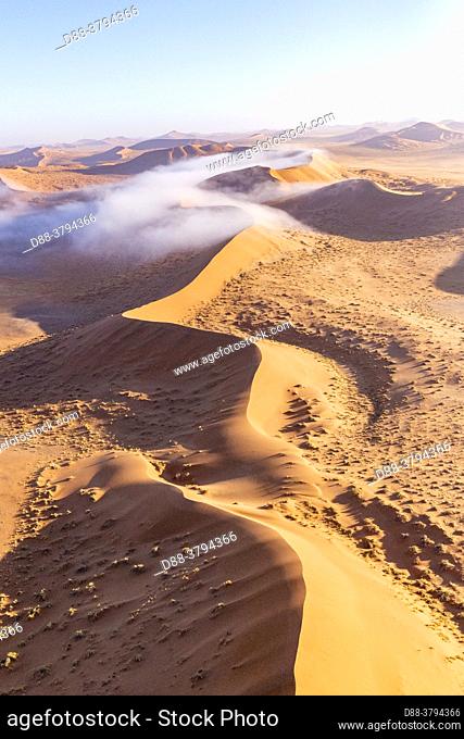 Namibia, Hardap region, Namib Desert, Namib-Naukluft National Park, Namib Erg listed as UNESCO World Heritage, Sossusvlei dunes, with mist