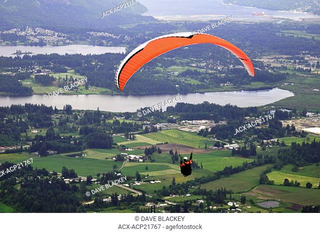 Paraglider sails from Mt. Prevost in Duncan, BC