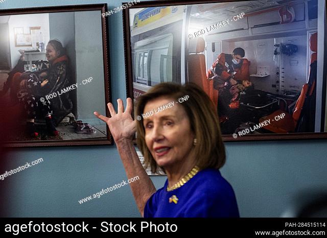 Speaker of the United States House of Representatives Nancy Pelosi (Democrat of California) stands near photographs from the war in Ukraine as she joins...