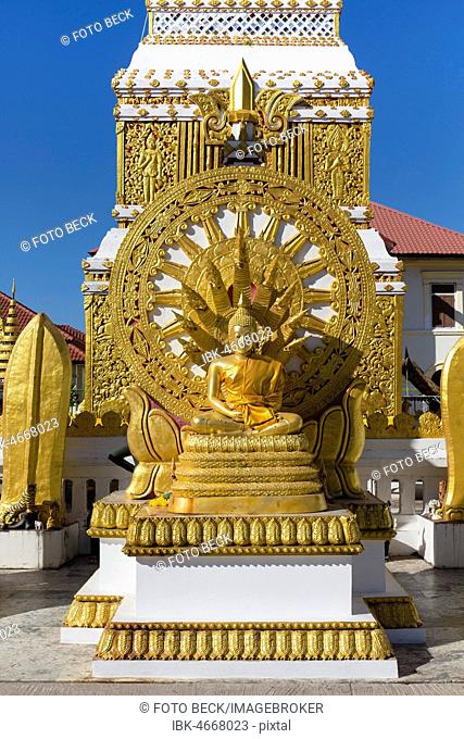 Wheel of Life and Golden Buddha Figure at the Chedi of Wat Mahathat Temple, Nakhon Phanom, Isan, Thailand