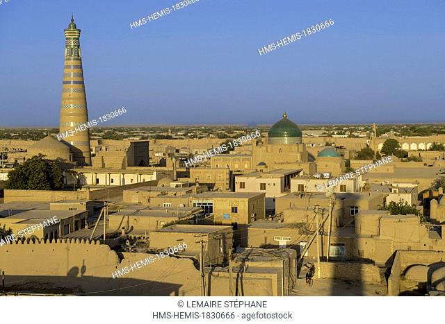 Uzbekistan, Silk Road, Khorezm province, Khiva, Itchan Kala protected city, listed as world heritage by UNESCO, city sight and Islam Hoja Minaret seen from the...
