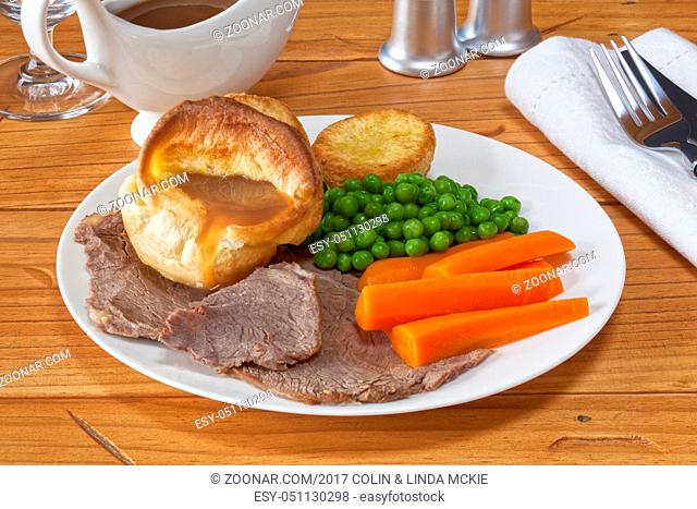 Roast Beef and Yorkshire Pudding - with gravy, roast potatoes, peas and carrots