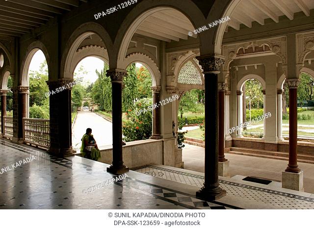 Arches in lobby and foyer of entrance overlooking garden and main entrance of Aga Khan palace built in 1892 by Sultan Mohamed Shah; Pune ; Maharashtra ; India