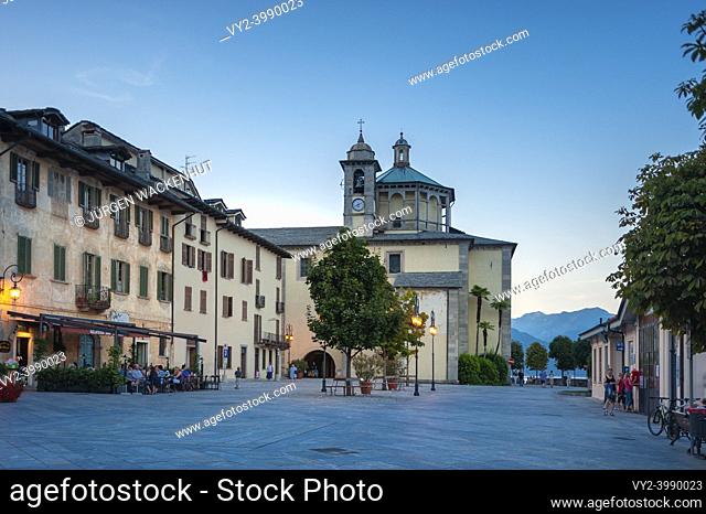 Promenade with historic house facades, in the background the Santuario della SS Pieta pilgrimage church, Cannobio Piedmont, Italy, Europe