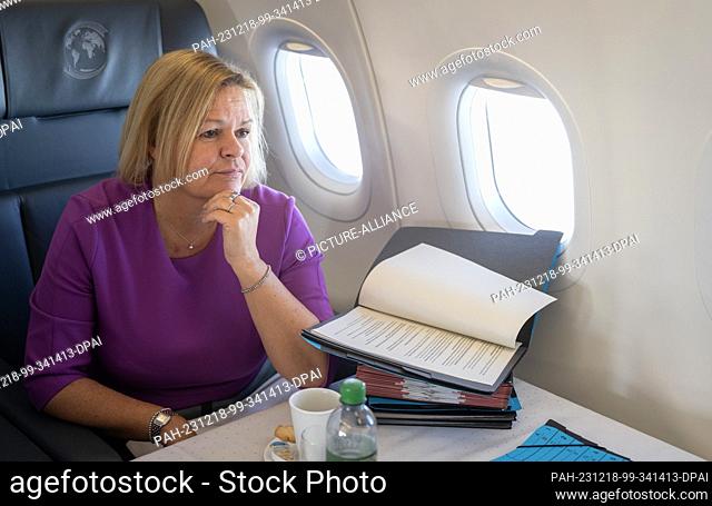 18 December 2023, Georgia, Tiflis: Federal Minister of the Interior Nancy Faeser (SPD) is sitting in an Airbus A-321 of the German Air Force on a flight to...