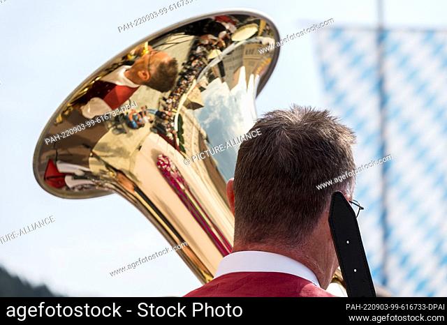 03 September 2022, Bavaria, Greding: A man plays the tuba at the 29th Greding Traditional Costume Market under the motto ""Heimat im Gepäck - die Vertriebenen...