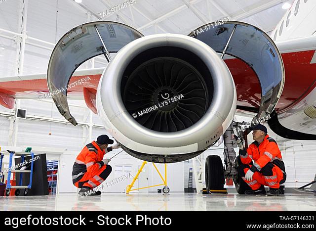 RUSSIA, MOSCOW REGION - FEBRUARY 1, 2023: Employees run a check on a Sukhoi Superjet 100 (SSJ100) aircraft's engines at a maintenance hangar of the Red Wings...