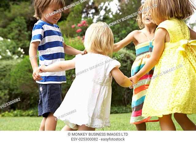 Group Of Children Playing Outdoors Together