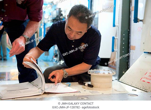 Japan Aerospace Exploration Agency (JAXA) astronaut Satoshi Furukawa, Expedition 2829 flight engineer, participates in an emergency scenario training session in...