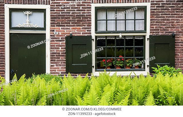 Giethoorn, The Netherlands - May 19., 2016: Front of monumental house in the small, picturesque town of Giethoorn, Overijssel, Netherlands