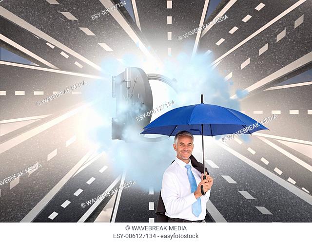 Composite image of businessman holding umbrella smiling at camera