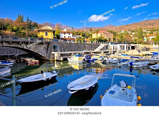 Icici village waterfront and harbor in Opatija riviera, turquoise sea and blue sky, Kvarner, Croatia