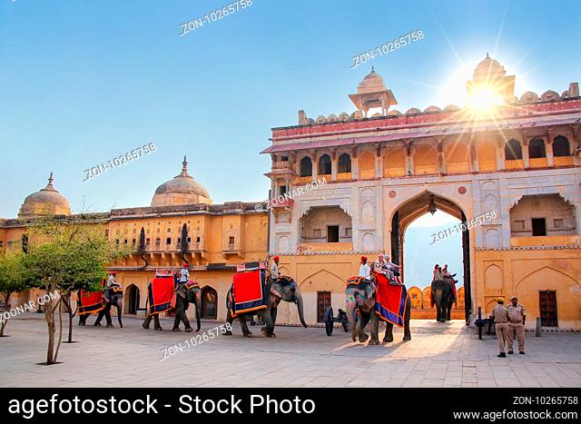 Decorated elephants entering Suraj Pol (Sun Gate) to Jaleb Chowk (main courtyard), Amber Fort, Rajasthan, India. Elephant rides are popular tourist attraction...