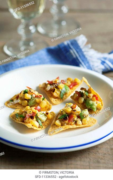 Tortilla chips with a sweetcorn and avocado salsa