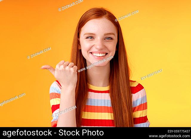 Girl pointing left cool person can help smiling delighted look friendly camera discuss interesting project introduce friend during conversation standing happy...
