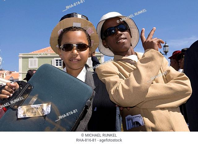 Young men dressed as businesspeople during Carnival, Mindelo, Sao Vicente, Cape Verde, Africa