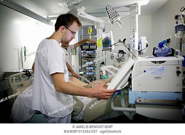Reportage in Robert Ballanger hospital's Intensive Care Unit in France. An intern in a patient's room