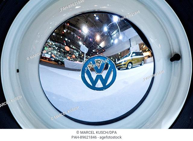 A Volkswagen T6 is reflected in the rims with a Volswagen logo at the Techno Classica for ""Oldtimers"" and ""Youngtimers"" in Essen, Germany, 5 April 2017