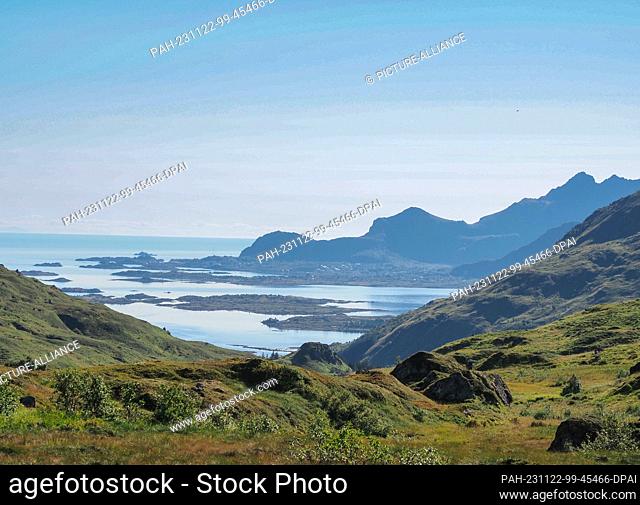 26 August 2023, Norway, Leknes: View of the fjord, green hills and granite rocks during a hike in the mountains near Leknes. Photo: Soeren Stache/dpa