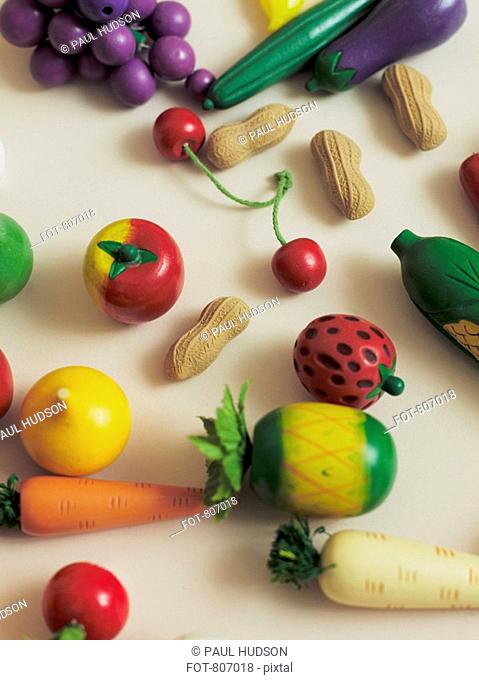 Arrangement of toy fruits and vegetables